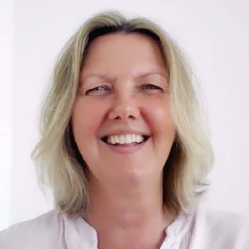 Close-up portrait of Kristina, a warm and intuitive mindset coach and holistic life coach