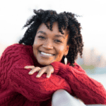 carefree woman smiling into camera