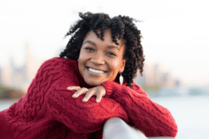 carefree woman smiling into camera