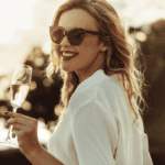 happy wealthy woman, with glass of champagne in her hand