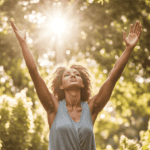 woman grateful and joyful, stretching up her arms, with the sun behind her