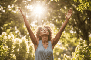 woman grateful and joyful, stretching up her arms, with the sun behind her