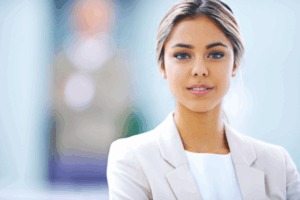 Peaceful woman looking calmly into camera, representing the journey from anxiety to calm through nervous system regulation