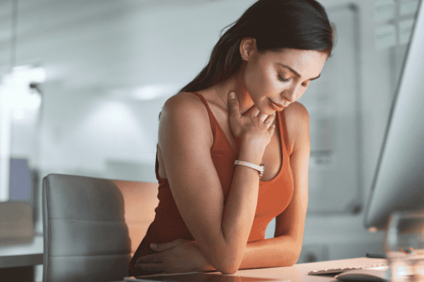 Contemplative woman with gentle expression looking inward, representing the journey of listening to your body's wisdom when feeling anxious without obvious cause